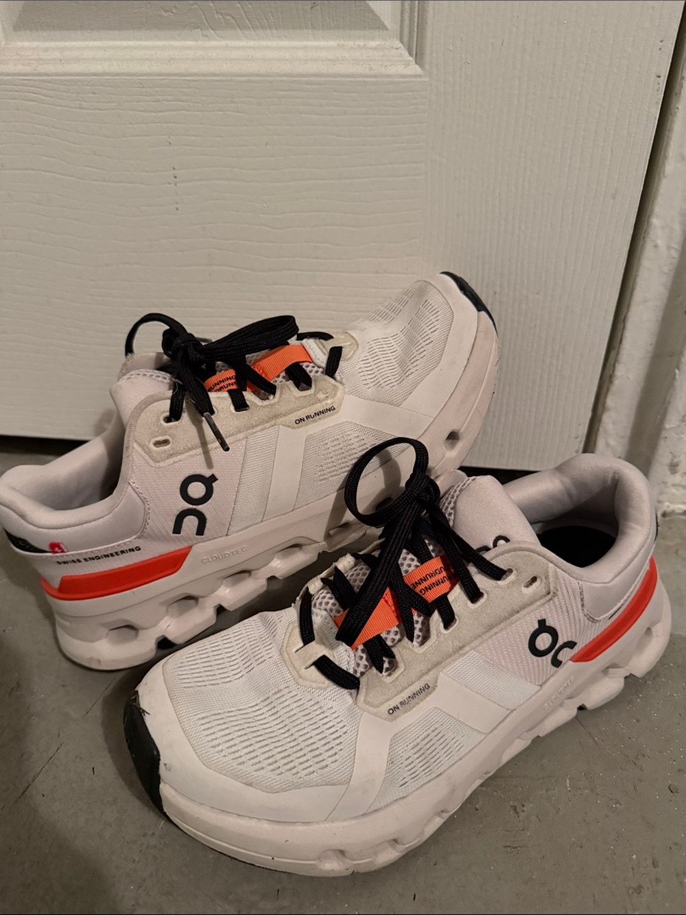 On Cloud White Sneakers with Orange and Black Accents